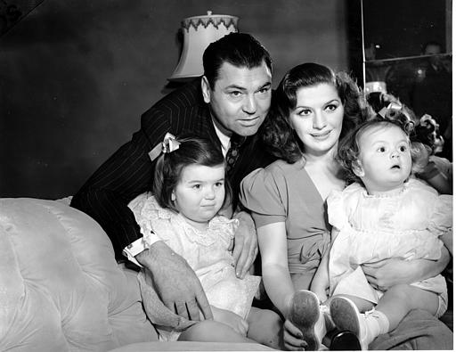 Heavyweight champion Jack Dempsey poses with his wife, the former Hannah Williams, and daughters Joan, 3 and-a-half, and Barbara, 15 months, at their New York City home on Dec. 25, 1937. 5691992.jpg
